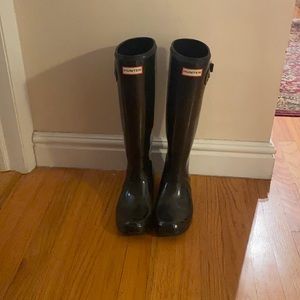 Tall black glossy Hunter boots